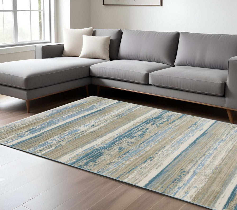 8' X 11' Ivory Beige Grey Blue And Tan Abstract Power Loom Stain Resistant Area Rug With Fringe - Homeroots - Flyclothing LLC