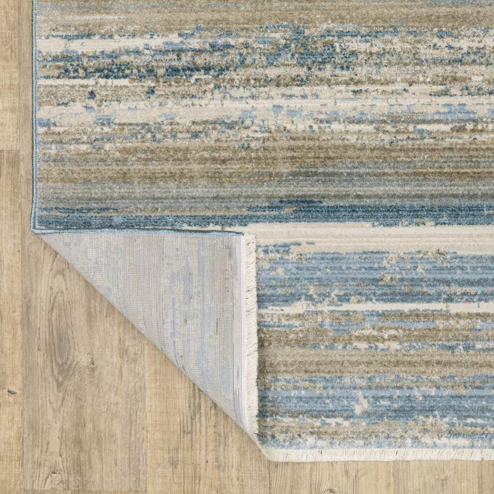 10' X 13' Ivory Beige Grey Blue And Tan Abstract Power Loom Stain Resistant Area Rug With Fringe - Homeroots - Flyclothing LLC
