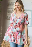 Heimish Full Size Floral V-Neck Short Sleeve Babydoll Blouse - Trendsi - Flyclothing LLC