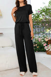 Round Neck Open Back Jumpsuit with Pockets - Trendsi - Flyclothing LLC
