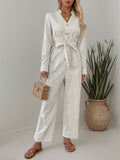 Striped Notched Long Sleeve Tie Waist Jumpsuit - Trendsi