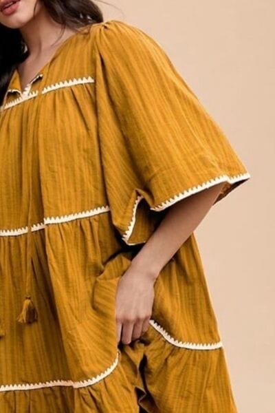 Annie Wear Tassel Contrast Trim Tie Neck Half Sleeve Tiered Dress - Trendsi