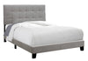 Marco de cama de madera maciza y manufacturada de color gris, tapizado en lino