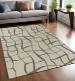 5' X 7' Ivory Machine Woven Abstract Indoor Shag Rug - Homeroots