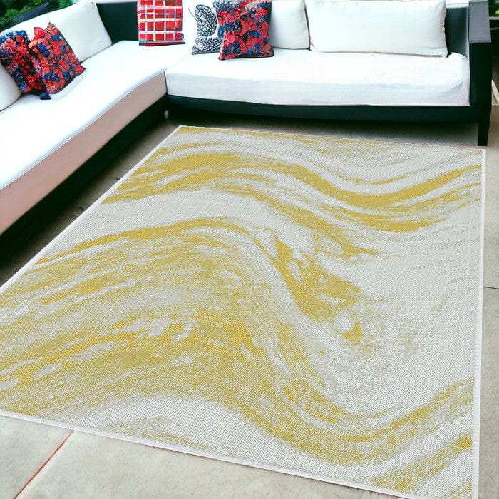 5' X 8' Gold and Ivory Abstract Indoor Outdoor Area Rug - Homeroots