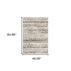 4' X 6' Ivory And Black Eclectic Patterns Indoor Area Rug