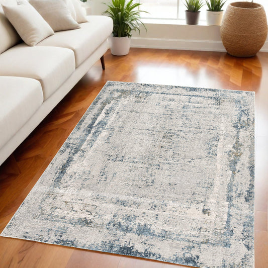 5' X 7' Blue and Ivory Abstract Area Rug