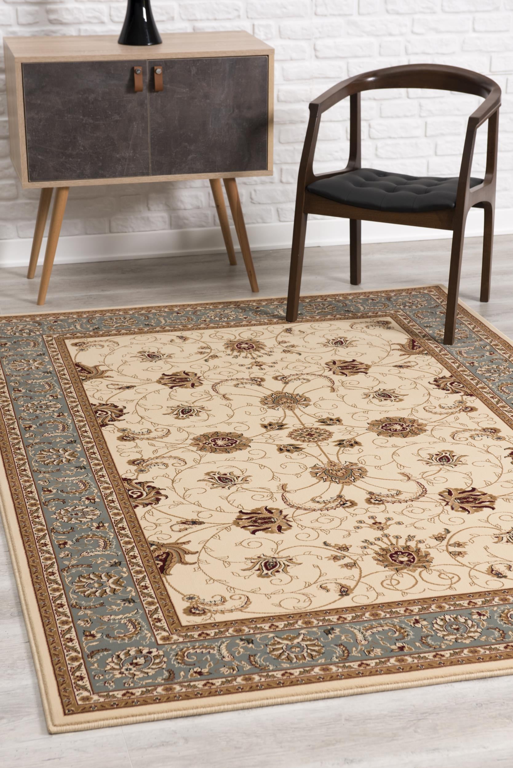 7' X 9' Blue and Ivory Oriental Power Loom Area Rug
