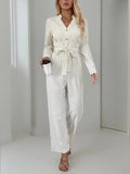 Striped Notched Long Sleeve Tie Waist Jumpsuit - Trendsi