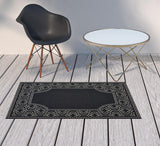 2' X 4' Black and Ivory Stain Resistant Indoor Outdoor Area Rug - Homeroots