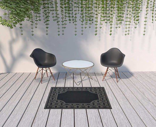4' X 6' Black and Ivory Stain Resistant Indoor Outdoor Area Rug - Homeroots - Flyclothing LLC