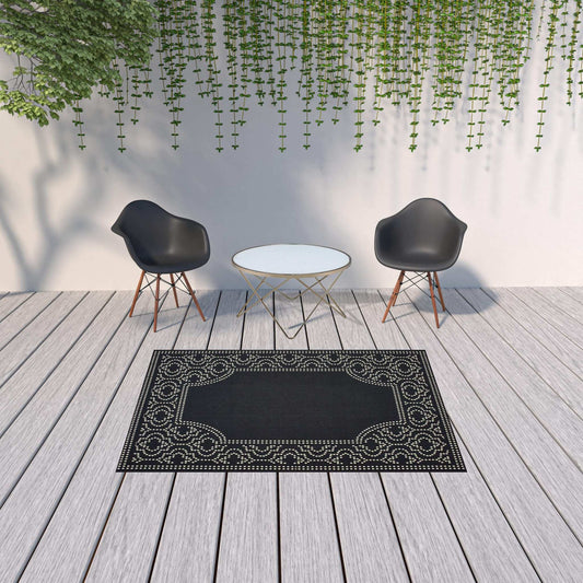 5' X 8' Black and Ivory Stain Resistant Indoor Outdoor Area Rug - Homeroots - Flyclothing LLC