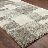 10' X 13' Grey Ivory And Silver Geometric Shag Power Loom Stain Resistant Area Rug