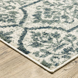 10' X 13' Ivory Blue And Sage Floral Power Loom Stain Resistant Area Rug
