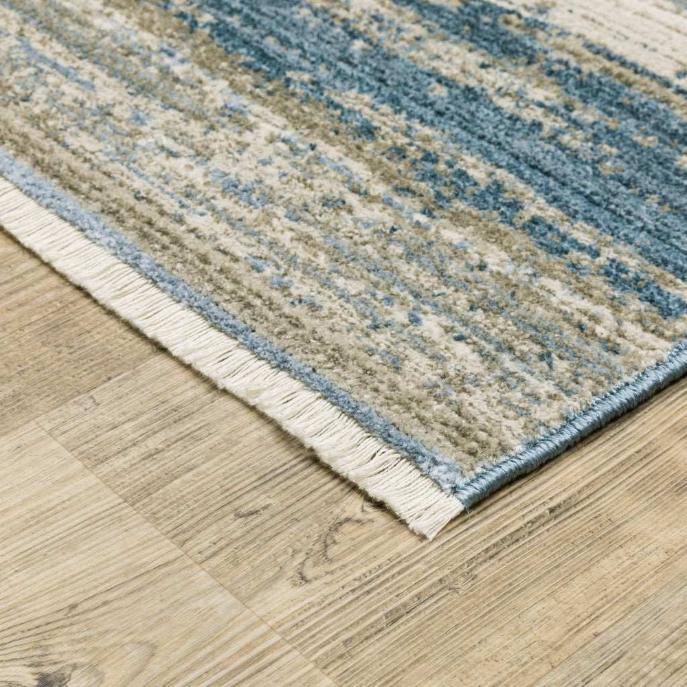 5' X 8' Ivory Beige Grey Blue And Tan Abstract Power Loom Stain Resistant Area Rug With Fringe - Homeroots - Flyclothing LLC