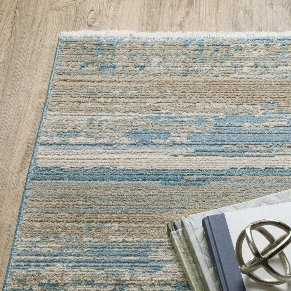 10' X 13' Ivory Beige Grey Blue And Tan Abstract Power Loom Stain Resistant Area Rug With Fringe - Homeroots - Flyclothing LLC