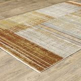 4' X 6' Rust Gold Blue Grey Ivory And Tan Geometric Power Loom Stain Resistant Area Rug With Fringe