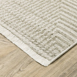 10' X 13' Ivory Beige Taupe And Tan Geometric Power Loom Stain Resistant Area Rug With Fringe
