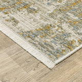 10' X 13' Beige Grey Gold Blue Rust And Teal Abstract Power Loom Stain Resistant Area Rug With Fringe - Homeroots