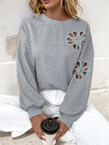 Perfee Cutout Pearl Round Neck Long Sleeve Sweatshirt - Trendsi