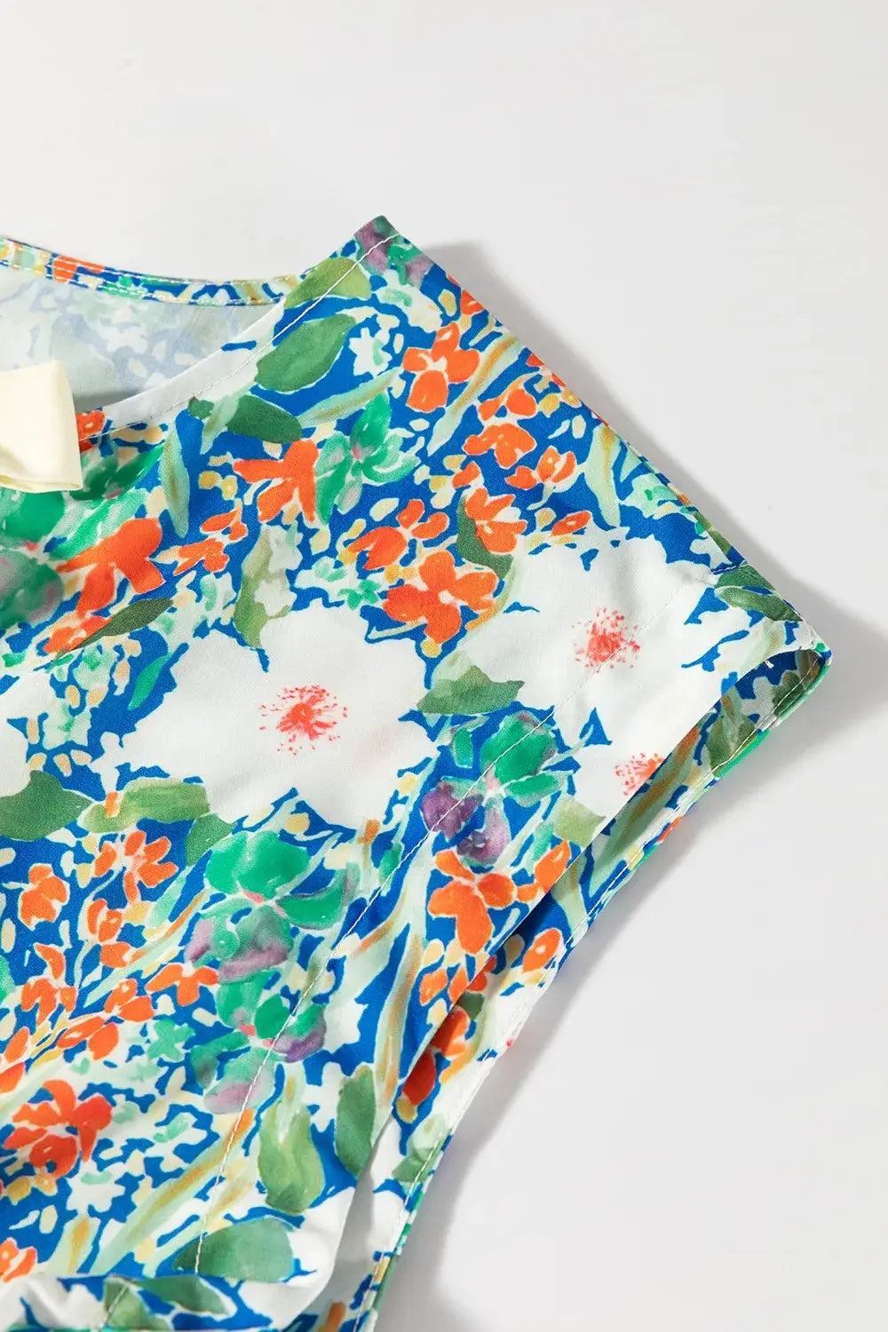 Floral Print Bow Applique Slit Sleeveless Peplum Blouse - Trendsi - Flyclothing LLC