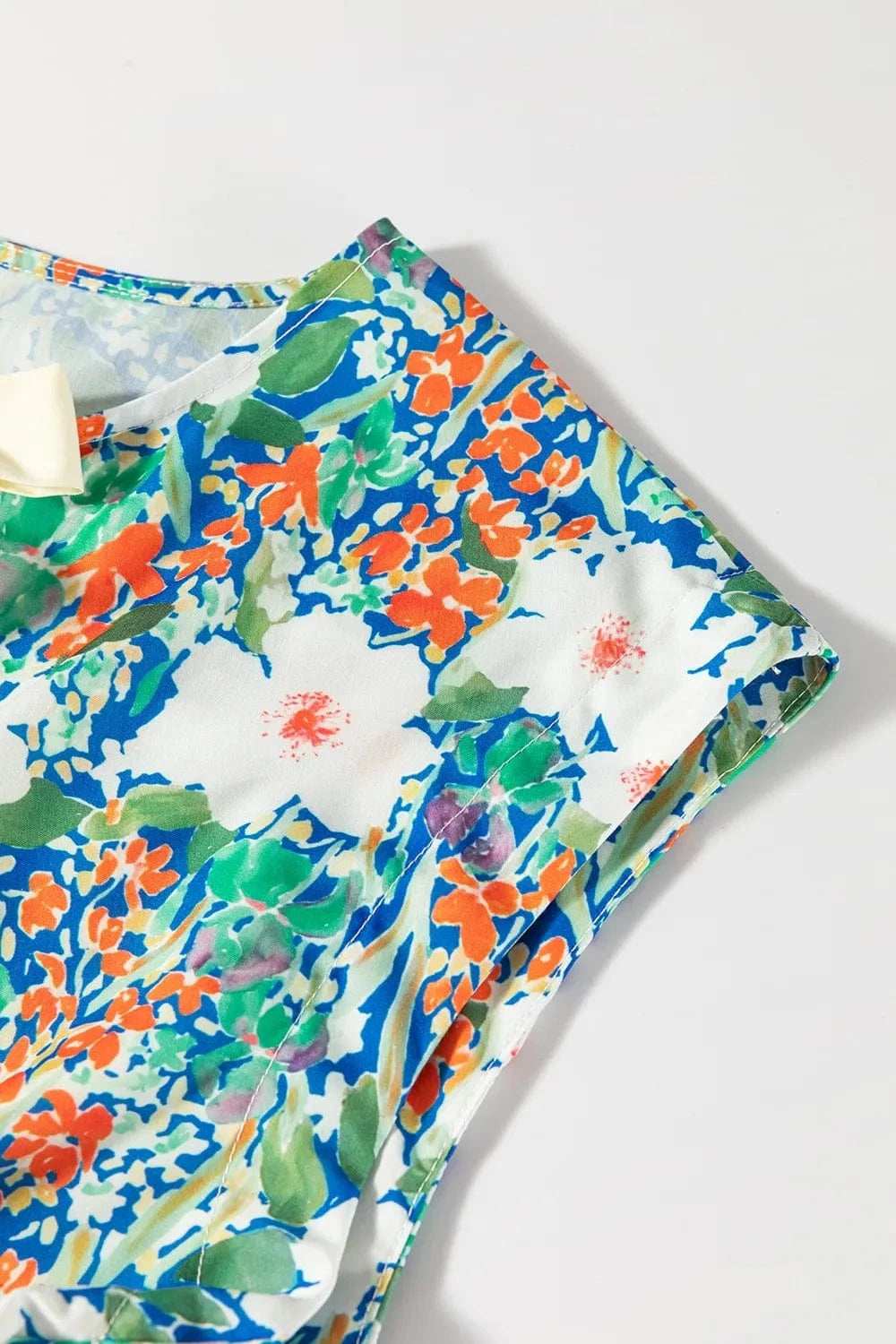 Floral Print Bow Applique Slit Sleeveless Peplum Blouse - Trendsi - Flyclothing LLC