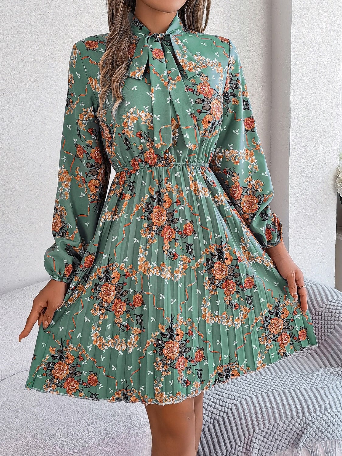 Pleated Printed Tie Neck Long Sleeve Dress - Trendsi