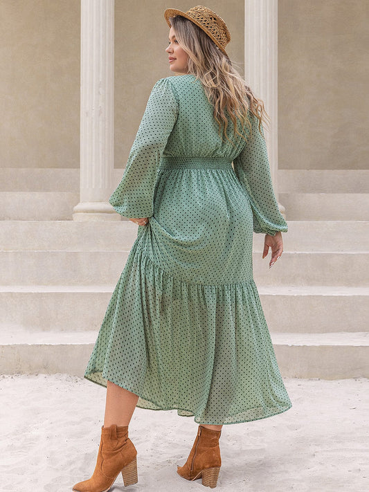 Plus Size Tassel Printed Tie Neck Long Sleeve Midi Dress - Trendsi