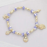 Metal Shell Puka Shell Starfish Charm Station Ceramic Ball Beaded Stretch Bracelet - Madeline Love - Flyclothing LLC