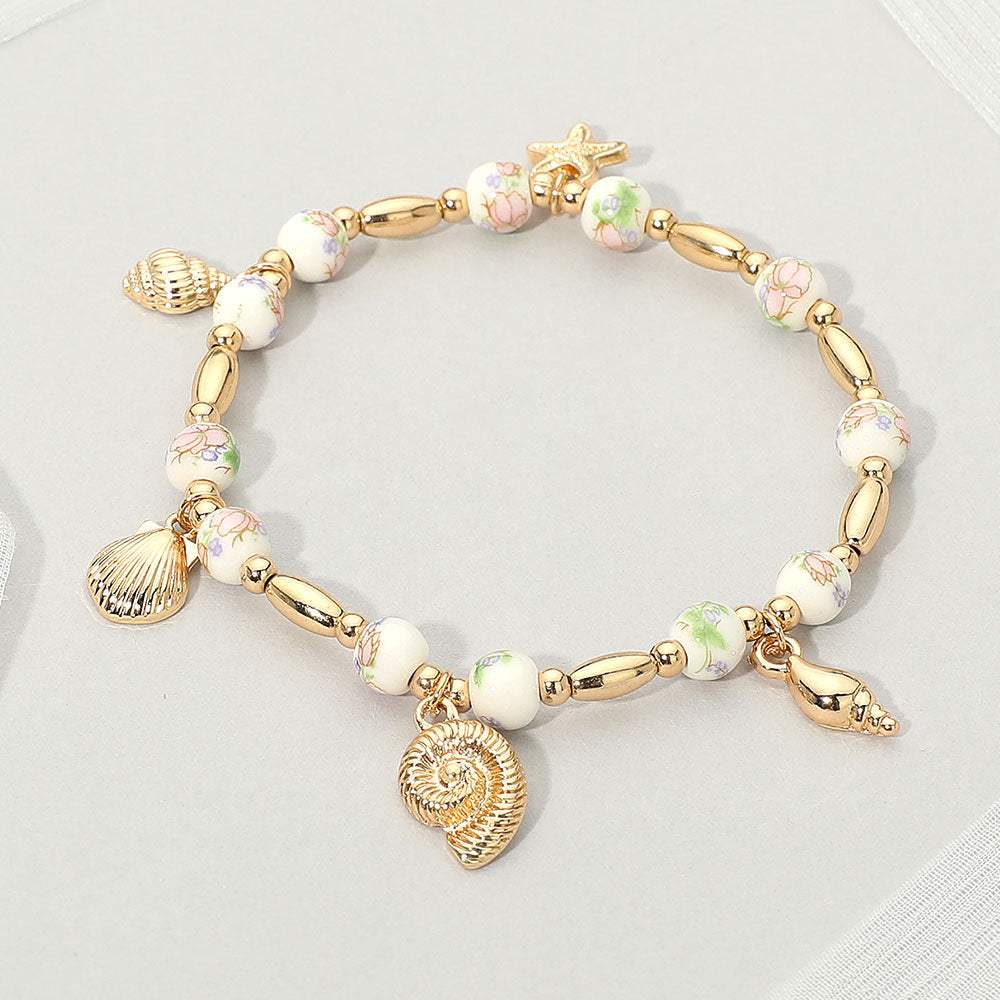 Metal Shell Puka Shell Starfish Charm Station Ceramic Ball Beaded Stretch Bracelet - Madeline Love - Flyclothing LLC