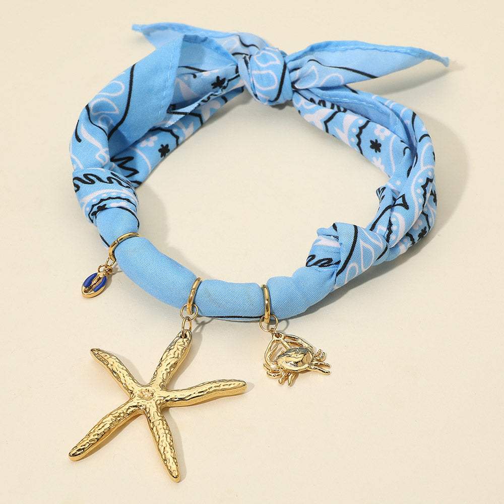 Textured Metal Starfish Conch Shell Crab Charm Nautical Print Fabric Wrap Statement Necklace - Madeline Love - Flyclothing LLC