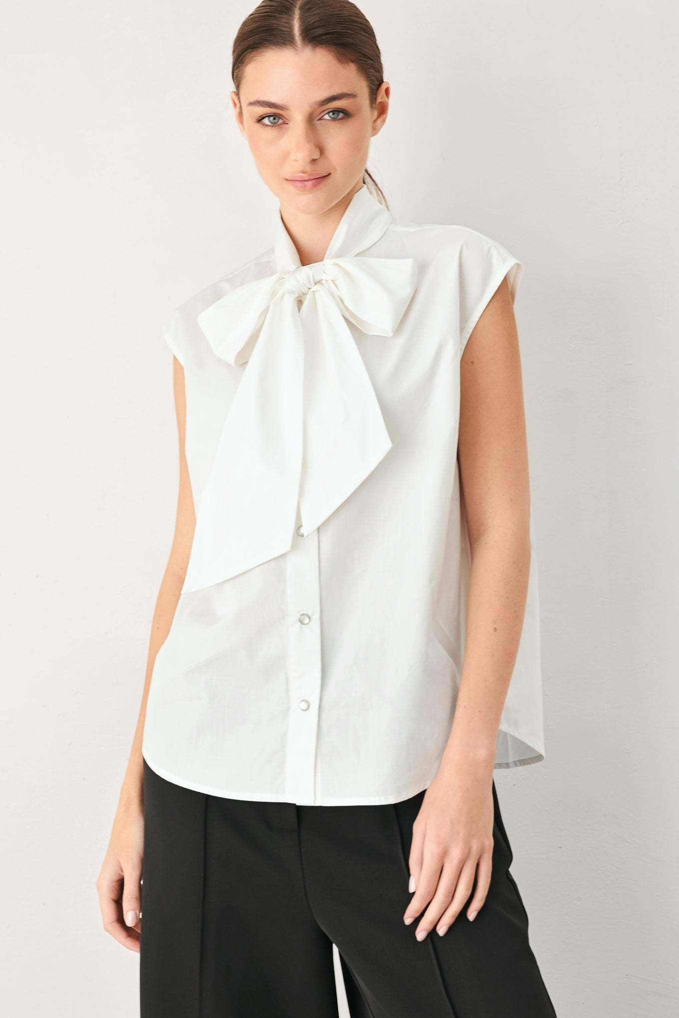 MODERN STATEMENT BOW WOVEN TOP