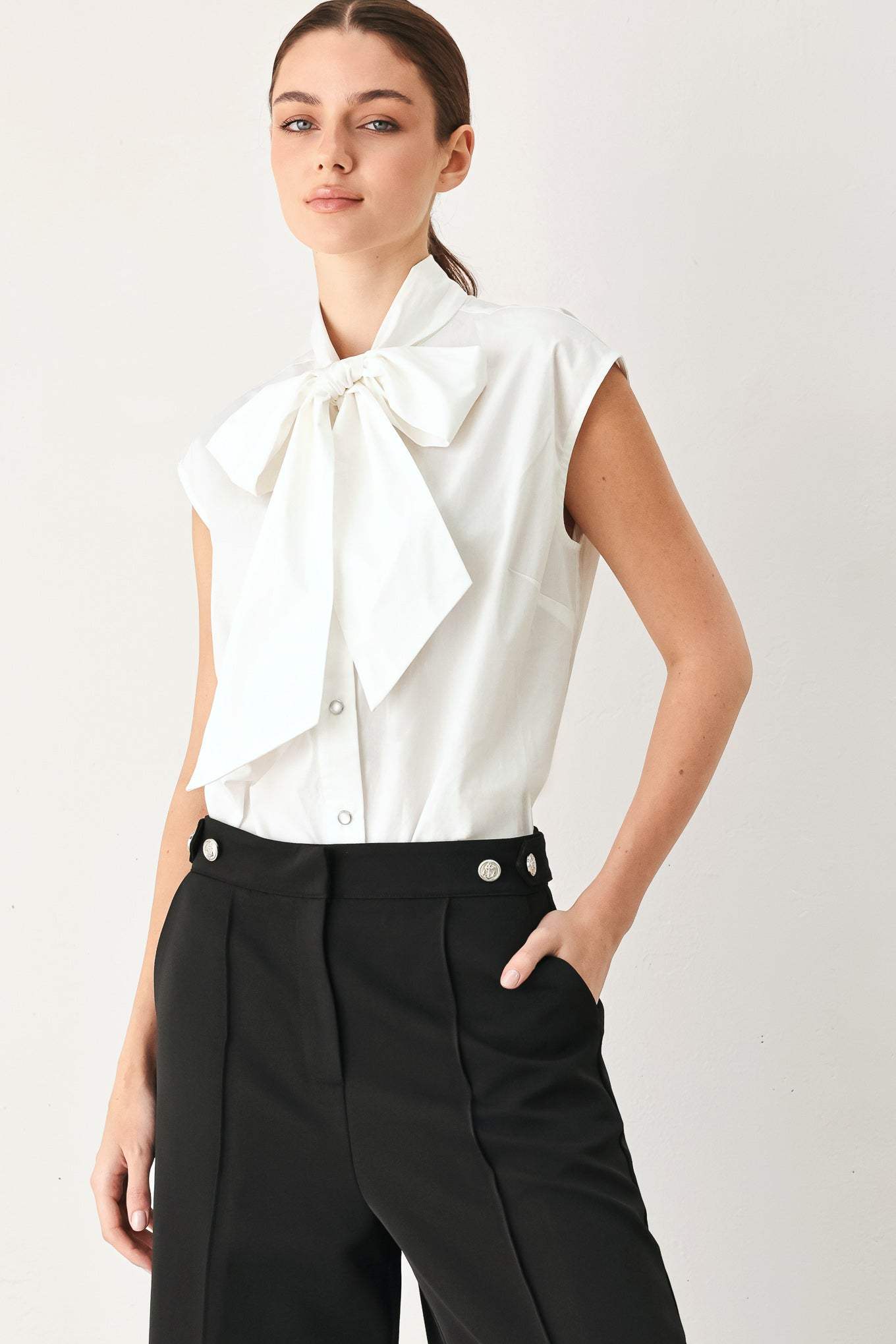 MODERN STATEMENT BOW WOVEN TOP
