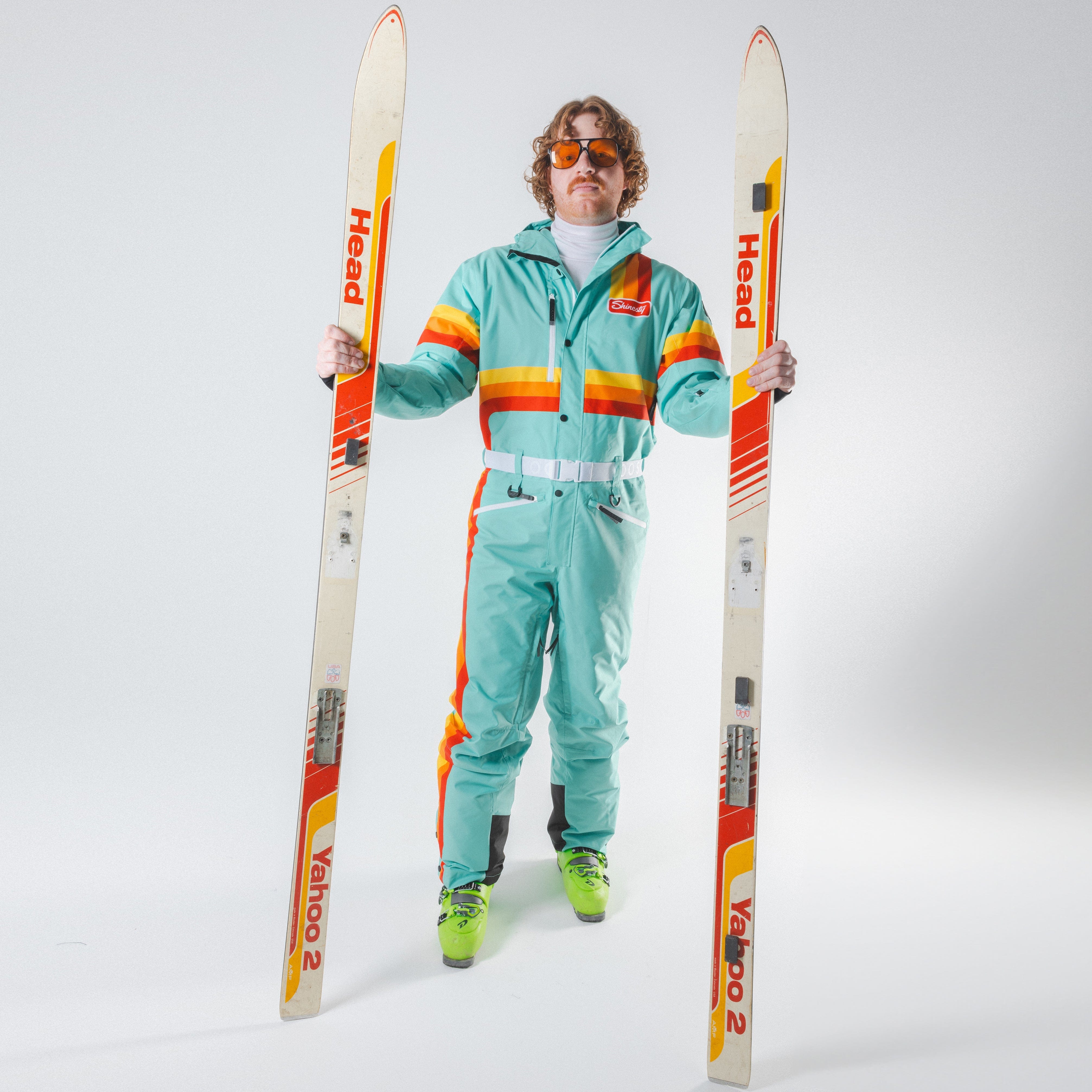 The Midday Aprés | Teal and Orange Retro Stripe One Piece Ski Suit - Shinesty