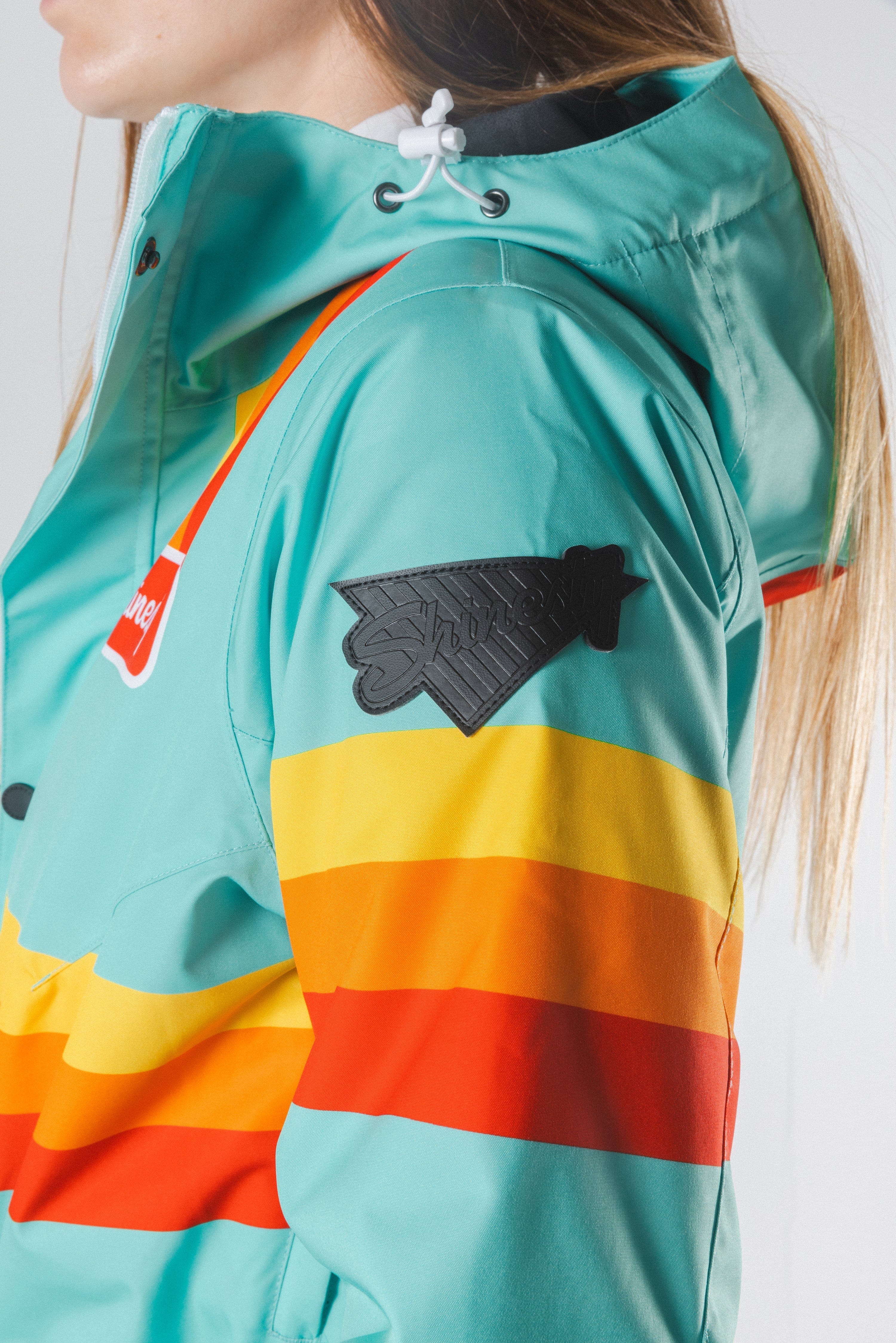 The Midday Aprés | Teal and Orange Retro Stripe Women's One Piece Ski Suit - Shinesty