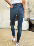 Judy Blue Full Size Mid Waist Distressed Slim Jeans - Trendsi