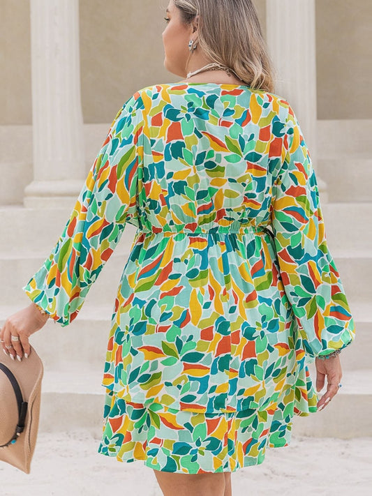 Plus Size Printed Surplice Long Sleeve Mini Dress - Trendsi