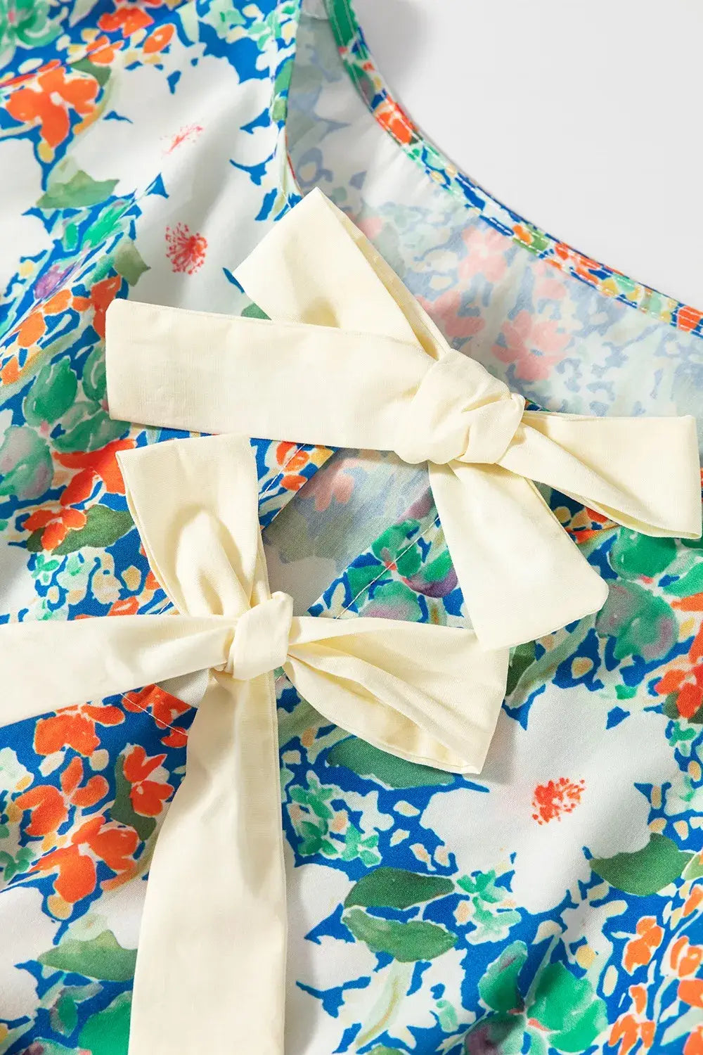 Floral Print Bow Applique Slit Sleeveless Peplum Blouse - Trendsi - Flyclothing LLC