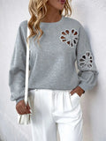 Perfee Cutout Pearl Round Neck Long Sleeve Sweatshirt - Trendsi
