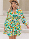 Plus Size Printed Surplice Long Sleeve Mini Dress - Trendsi