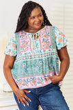 Perfee Floral Tie Neck Short Sleeve Blouse - Trendsi