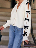 Bow V-Neck Cutout Sleeve Cardigan - Trendsi