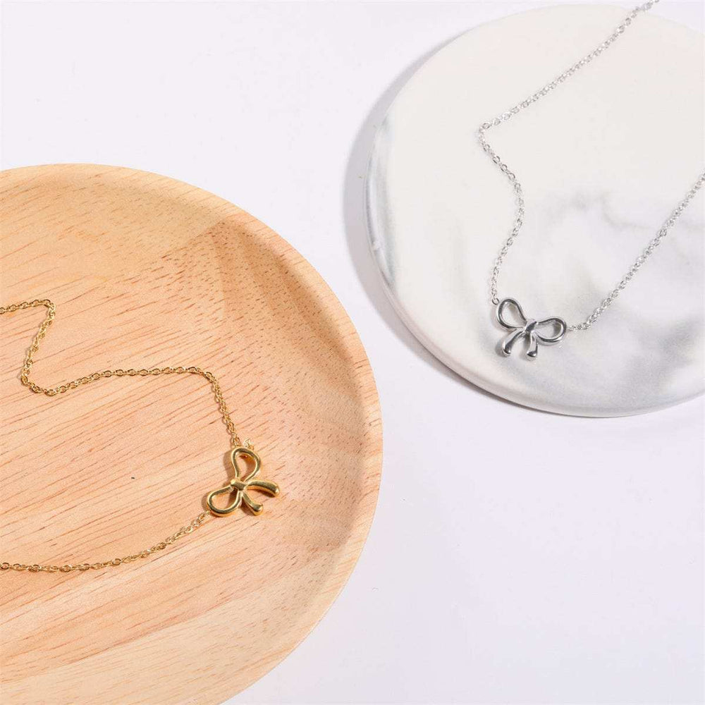 Titanium Steel Bow Pendant Necklace - Trendsi - Flyclothing LLC