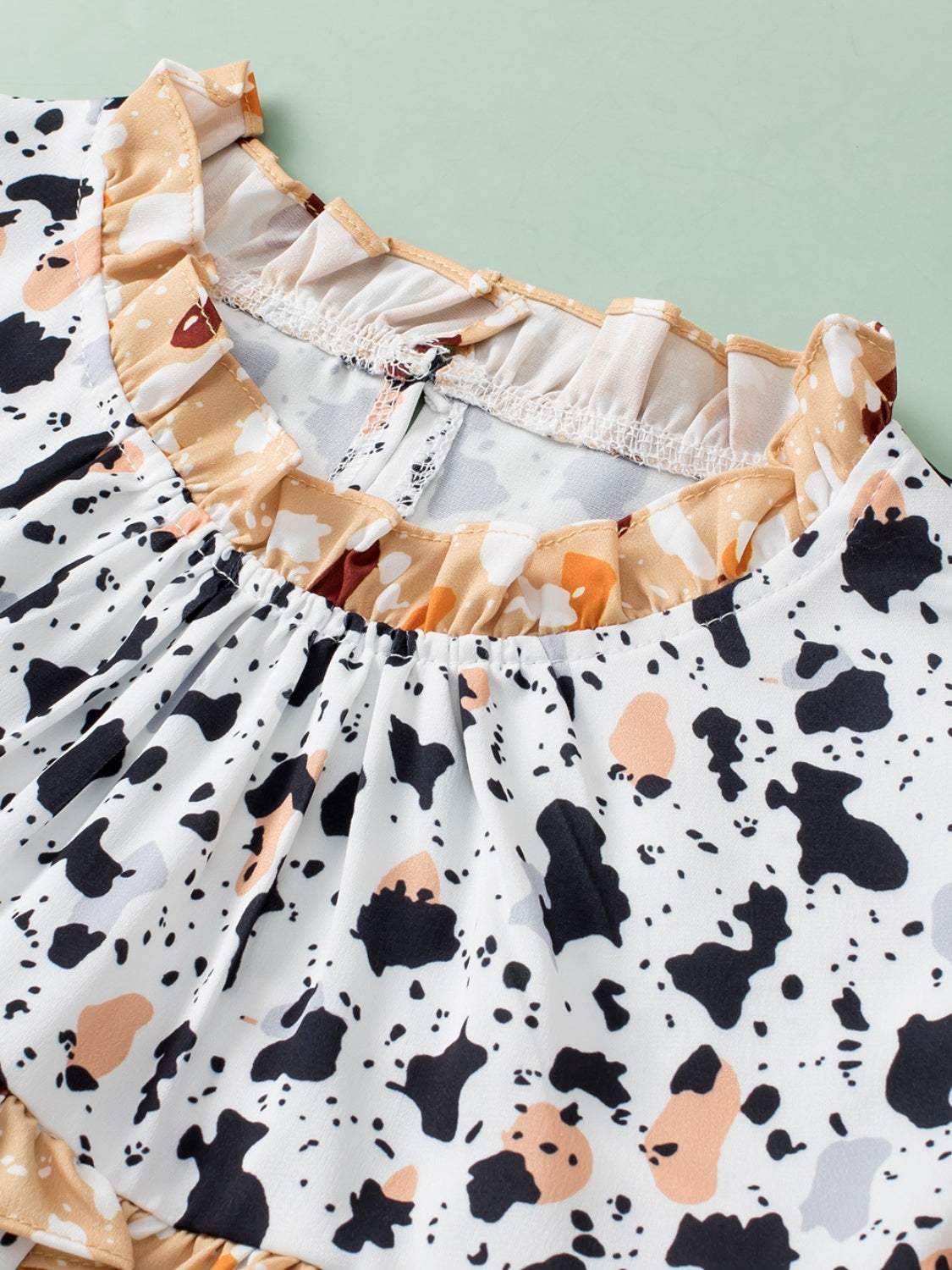 Ruffled Printed Mock Neck Cap Sleeve Blouse - Trendsi - Flyclothing LLC