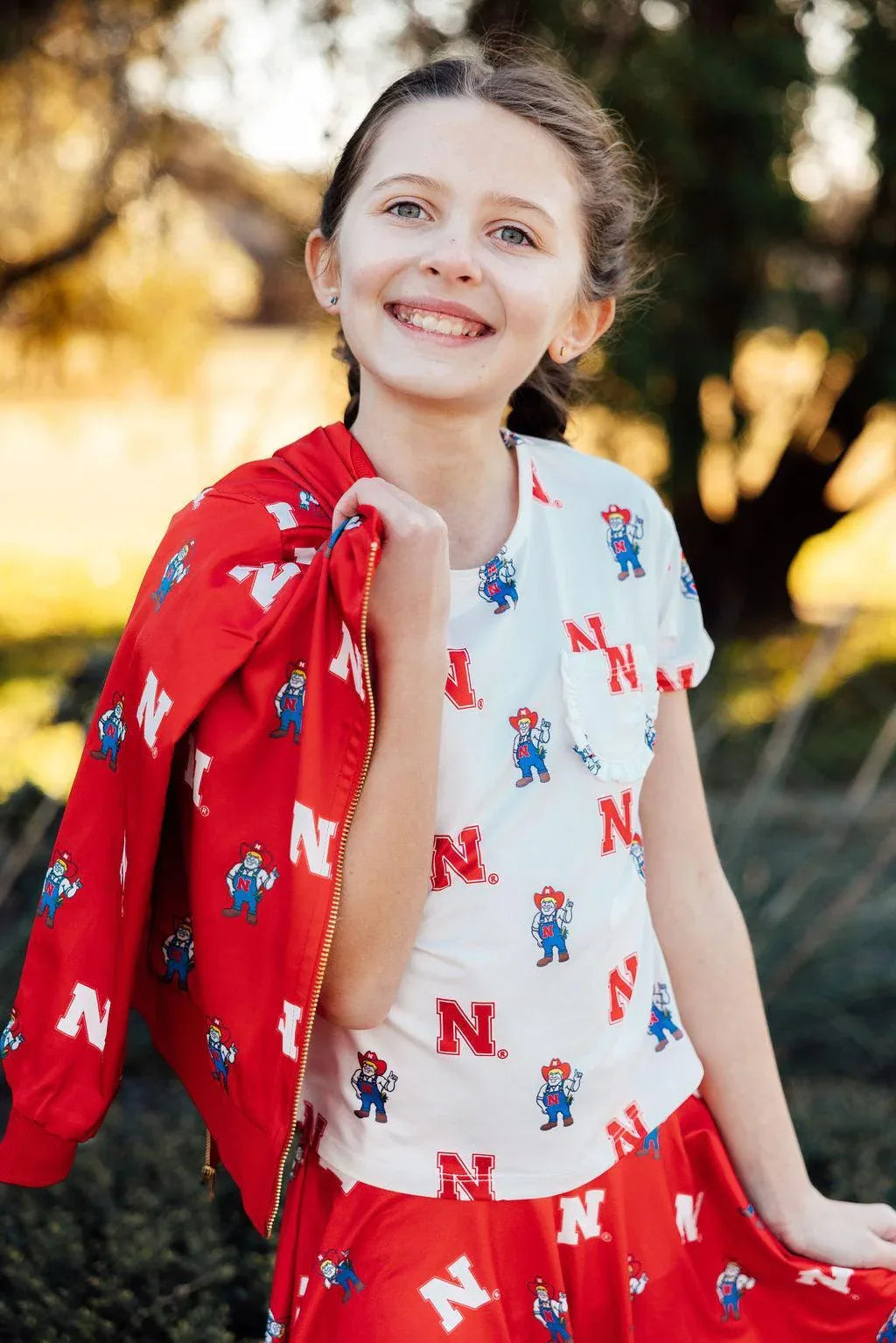 Nebraska White Herbie Husker Ruffle Pocket Tee - Mila & Rose ® - Flyclothing LLC