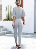 Buttoned Half Sleeve Round Neck Jumpsuit - Trendsi
