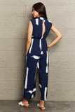 Printed Round Neck Cutout Jumpsuit with Pockets - Trendsi