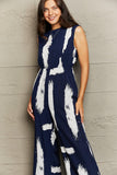 Printed Round Neck Cutout Jumpsuit with Pockets - Trendsi