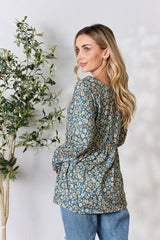 Heimish Full Size Floral Half Button Long Sleeve Blouse - Trendsi