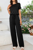 Round Neck Open Back Jumpsuit with Pockets - Trendsi